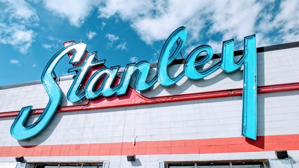 A blue "Stanley" logo located on the top of a white building